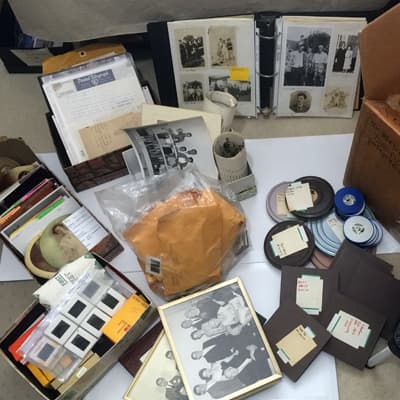 Collection of slides, film reels, and photo albums